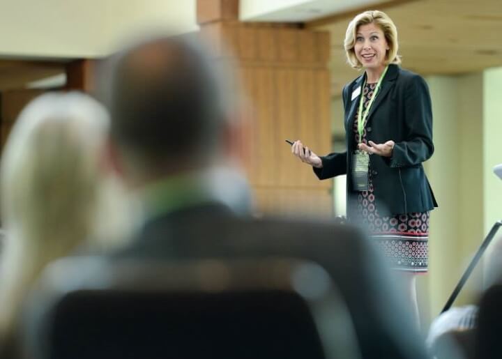 woman speaking to audience