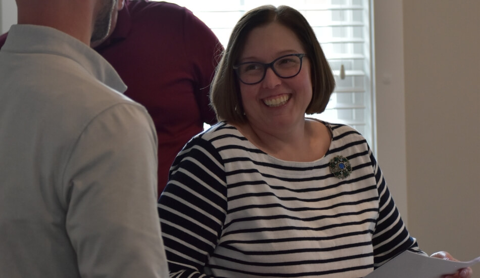 woman smiling in conversation